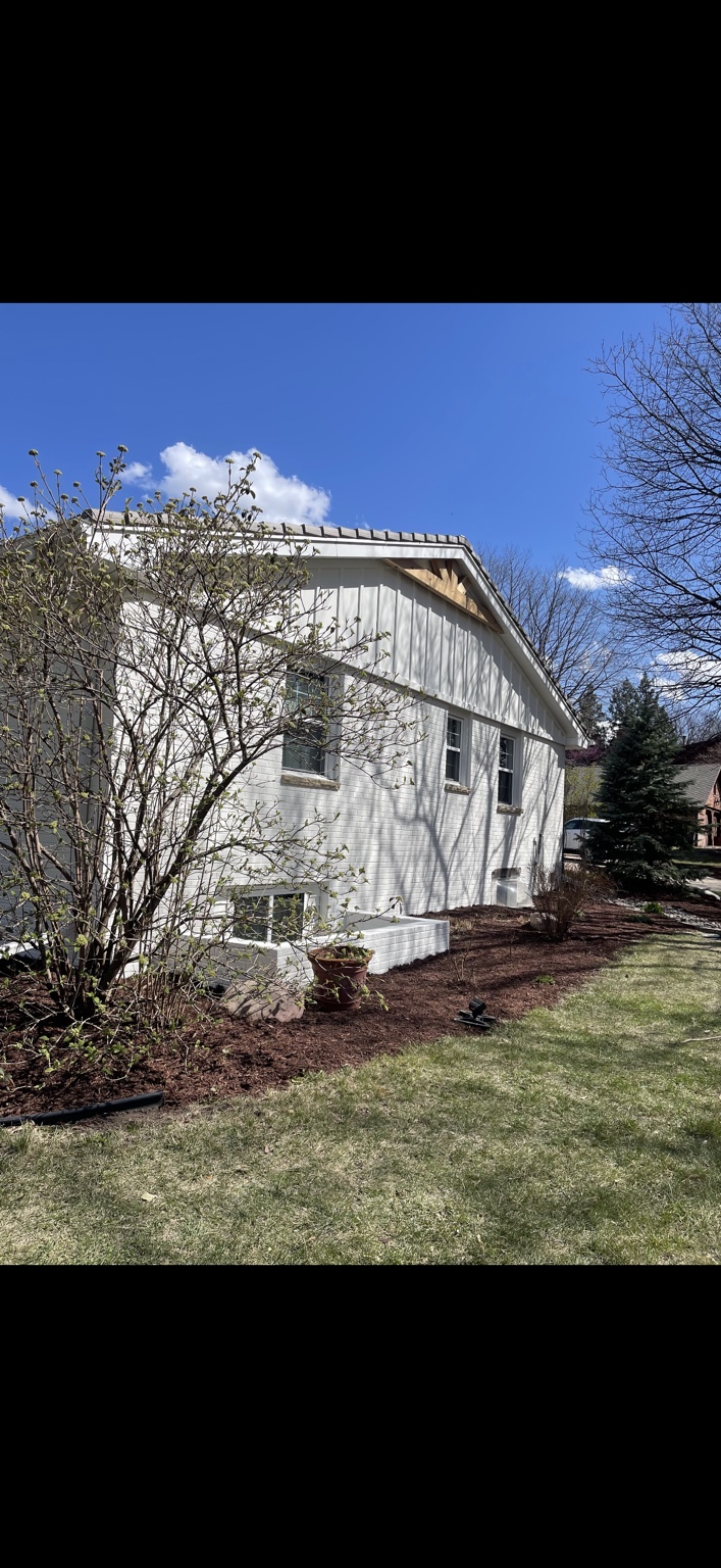 White painted brick on the gable end of the home