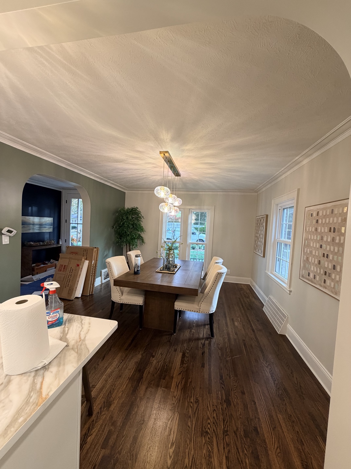 Dining room with soft neutral and green tones