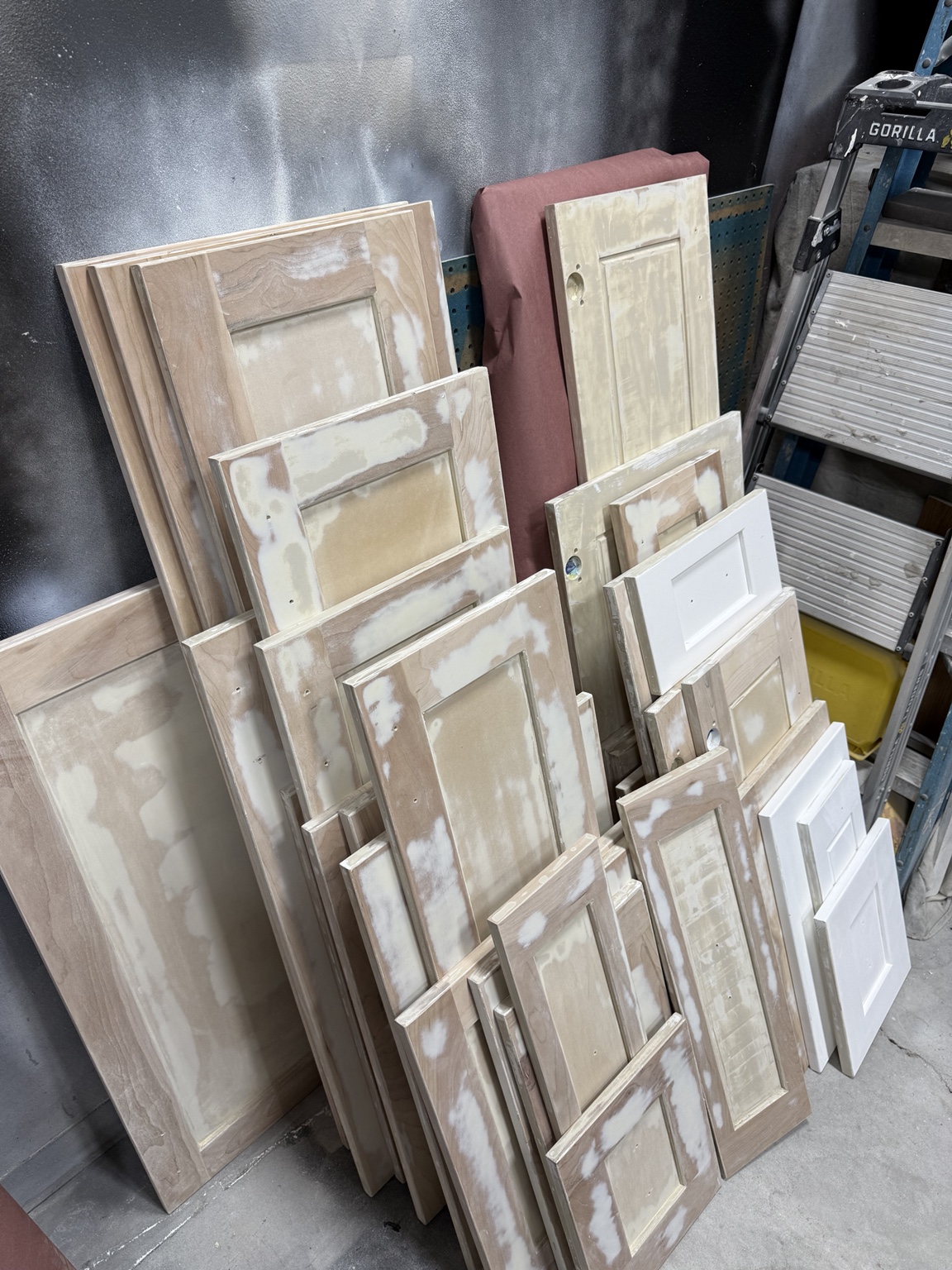 Cabinet doors in the workshop during stripping and surface preparation